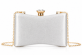 A silver satin clutch bag with a gold-tone chain strap and a rhinestone-embellished clasp, shown on a plain white background.