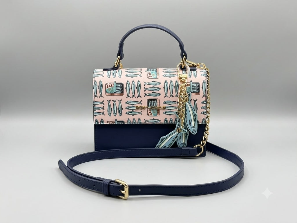 Designer handbag with a patterned flap and chain strap on a light gray background