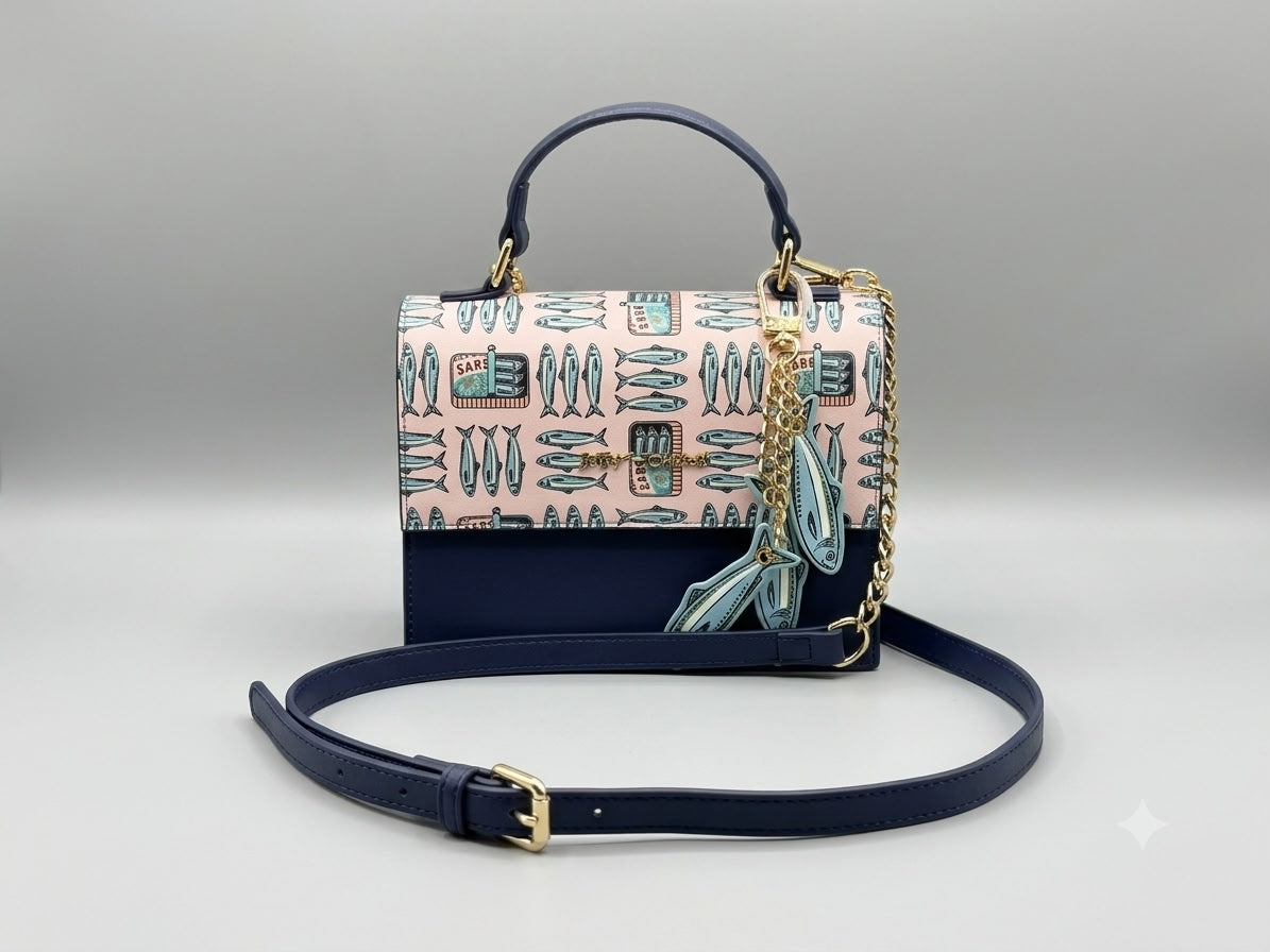 Designer handbag with a patterned flap and chain strap on a light gray background