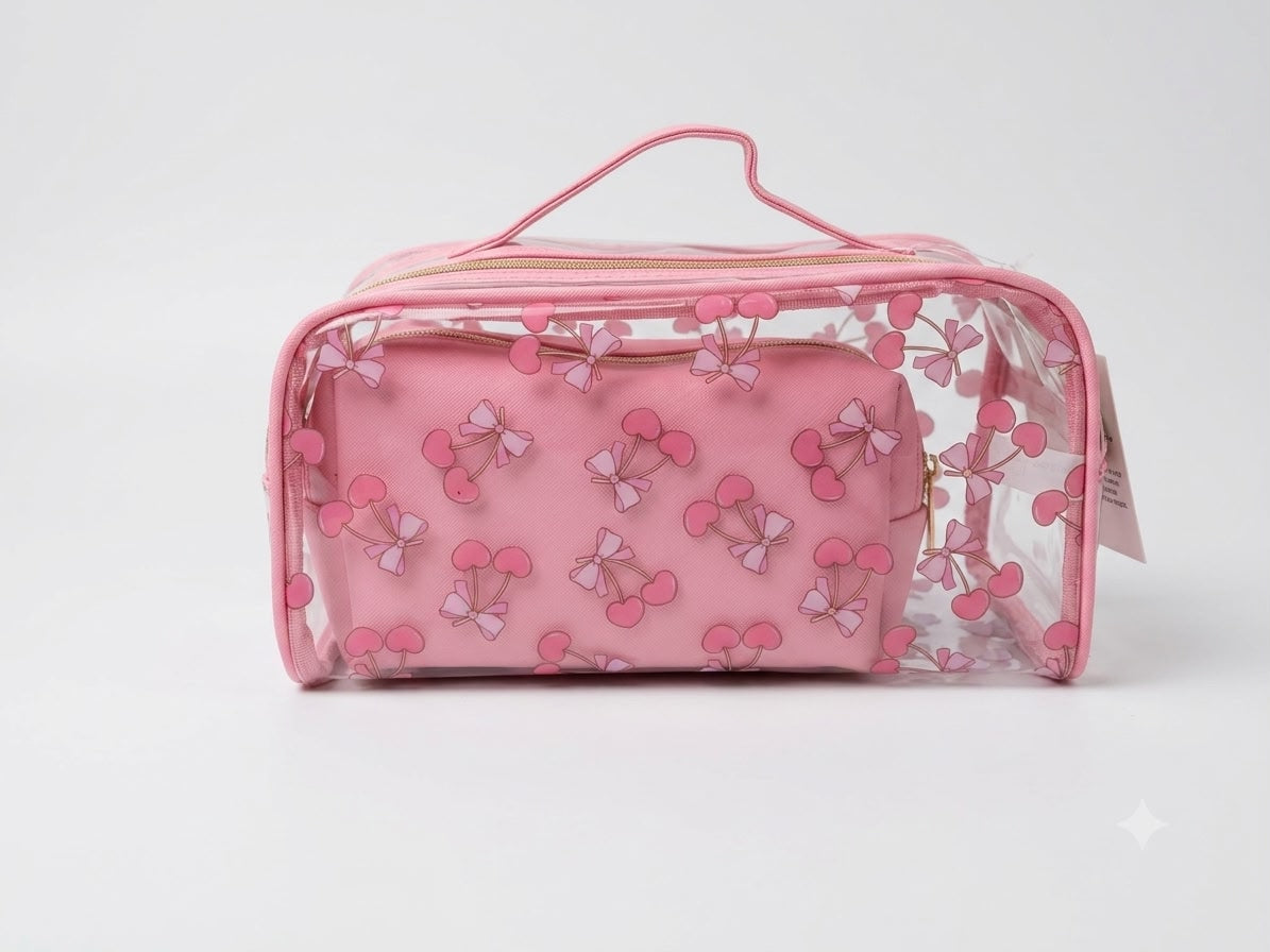Pink toiletry bag with bow pattern on a light gray background